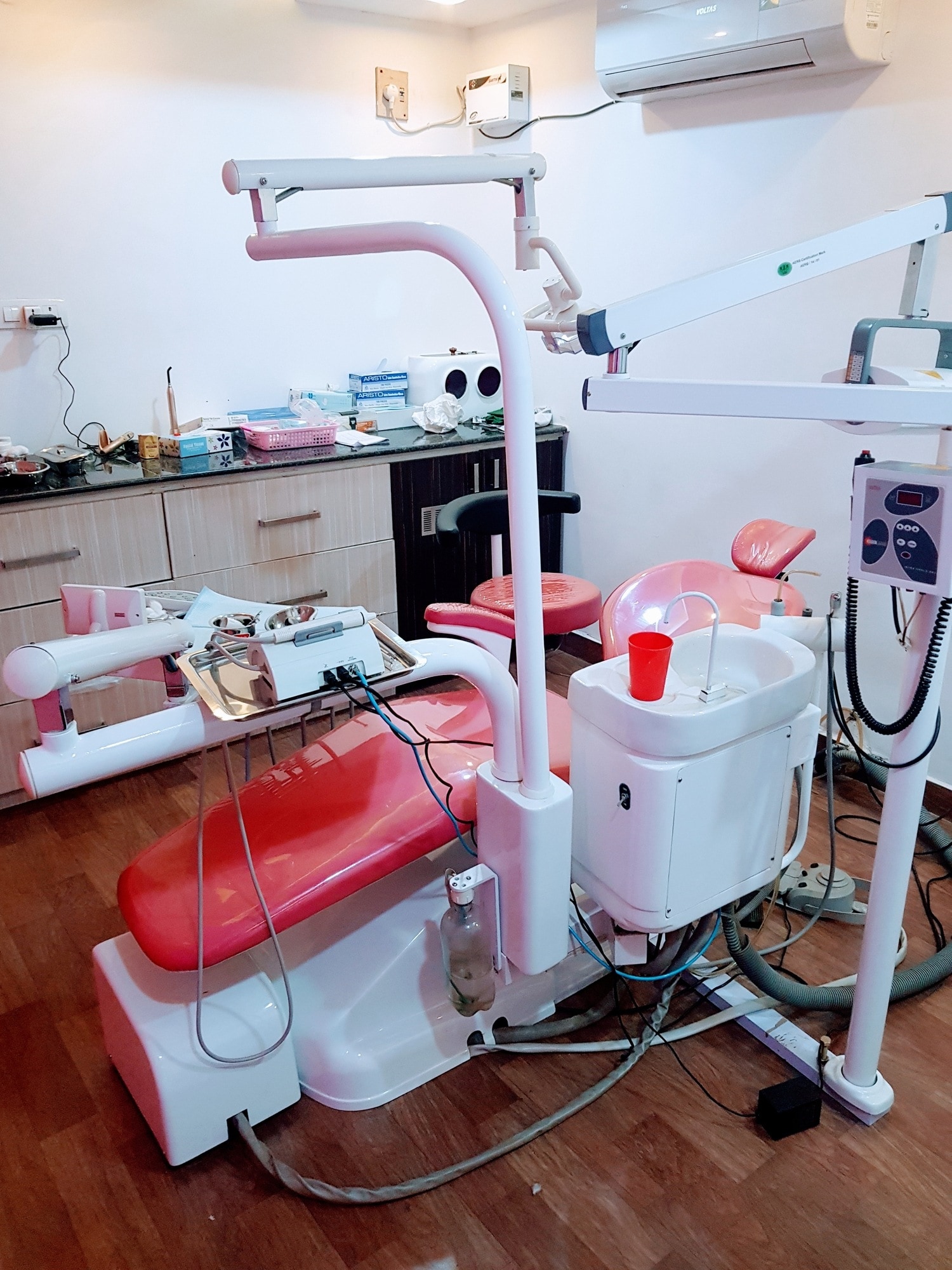 Dr. Siva performing dental treatment at Pearl Smile Dental Clinic